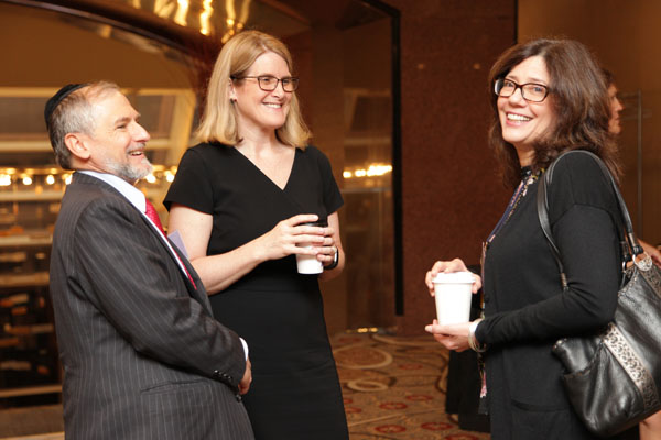 Caroline Ciraolo chatting with attendees at NYC KF LAW tax forum