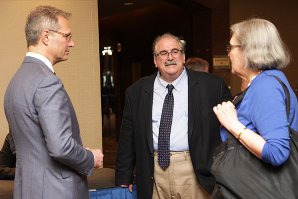 KF Law Tax Forum 2022 co-chairs Bryan and Frank Agostino with another attendee